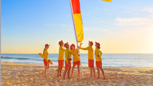 Surf Life Savers Putting up Red & Yellow Flags