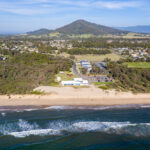 Shoalhaven Heads Surf Life Saving Club overhead shot showing the hall and beach