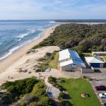 Shoalhaven Heads Surf Life Saving Club overhead shot showing the hall and beach