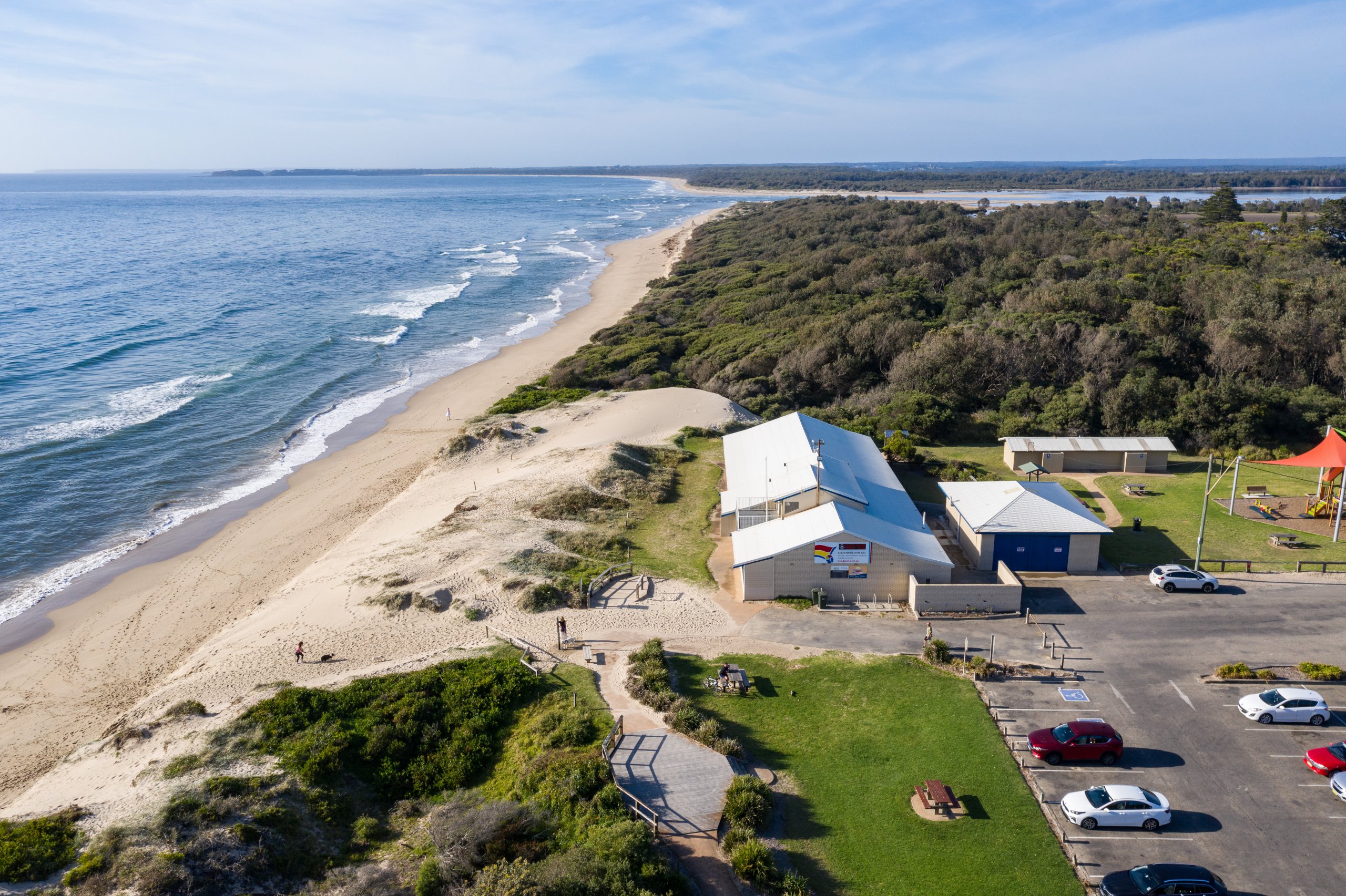 Shoalhaven Heads Surf Life Saving Club overhead shot showing the hall and beach
